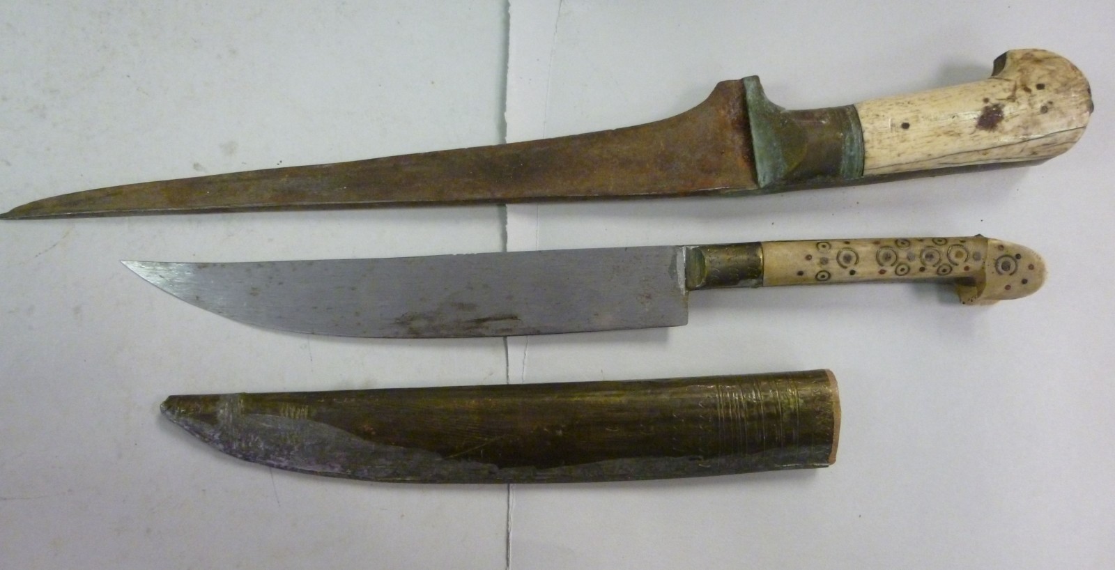 A late 19thC Khyber knife, having a two part bone handle the blade 12``L; and another, the bone