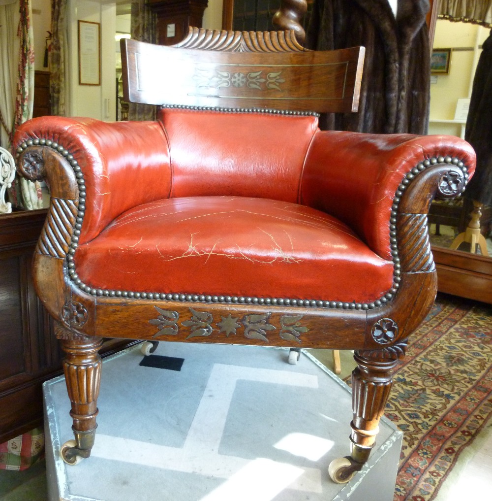 A William IV inlaid brass and rosewood framed tub style, lyre front salon chair, upholstered in