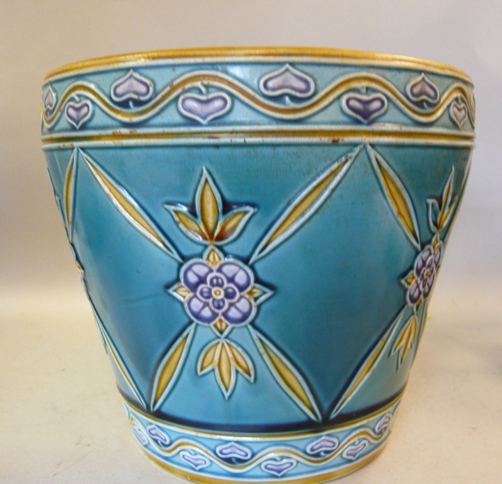 A late 19th/early 20thC Minton majolica jardiniere of flower pot design, decorated in tones of