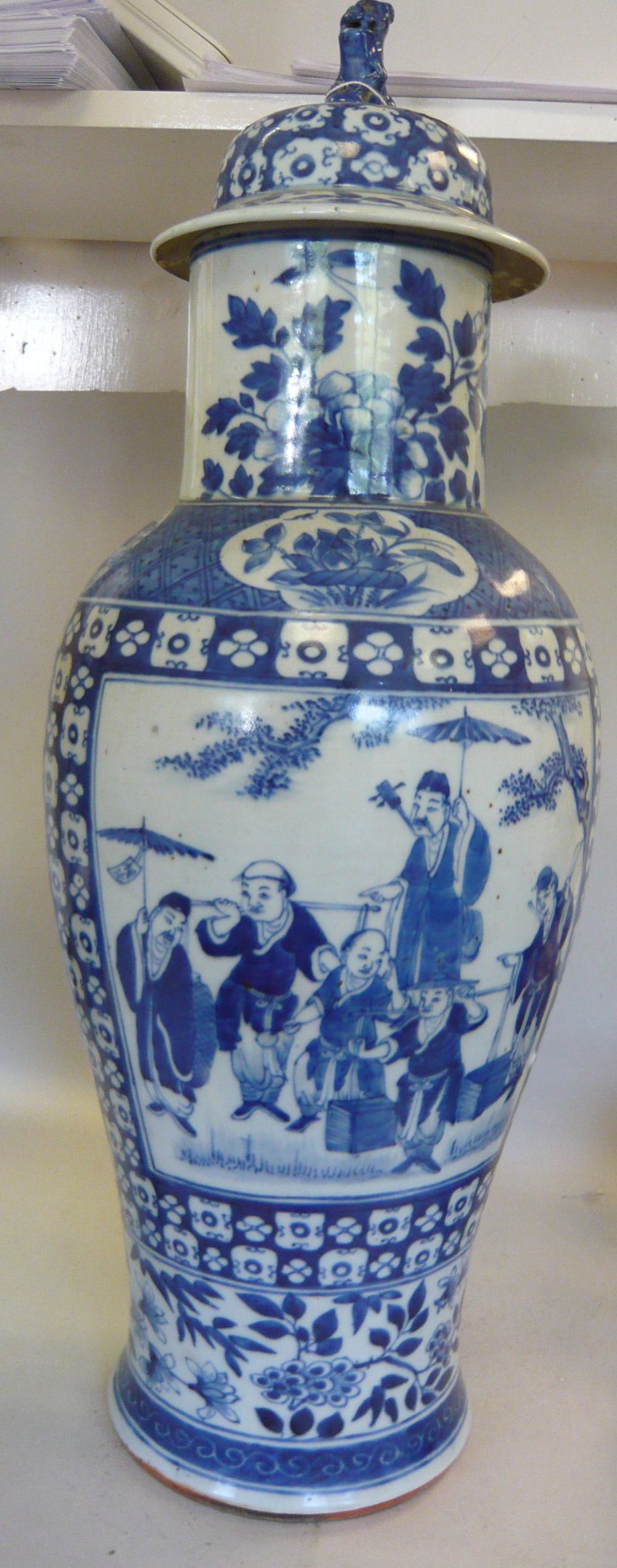 A mid 19thC Chinese porcelain vase of waisted baluster form, having a wide neck and a domed cover,