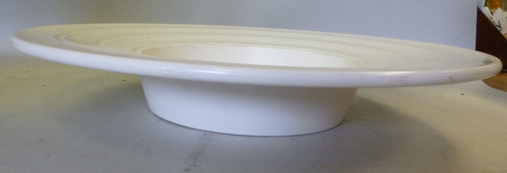 A Keith Murray Wedgwood ivory glazed pottery moonstone tray, having a recessed centre and a wide,