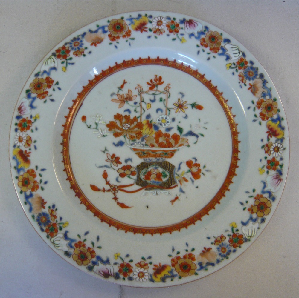 An early 18thC Chinese porcelain dish, decorated in famille rose to the centre with a flower