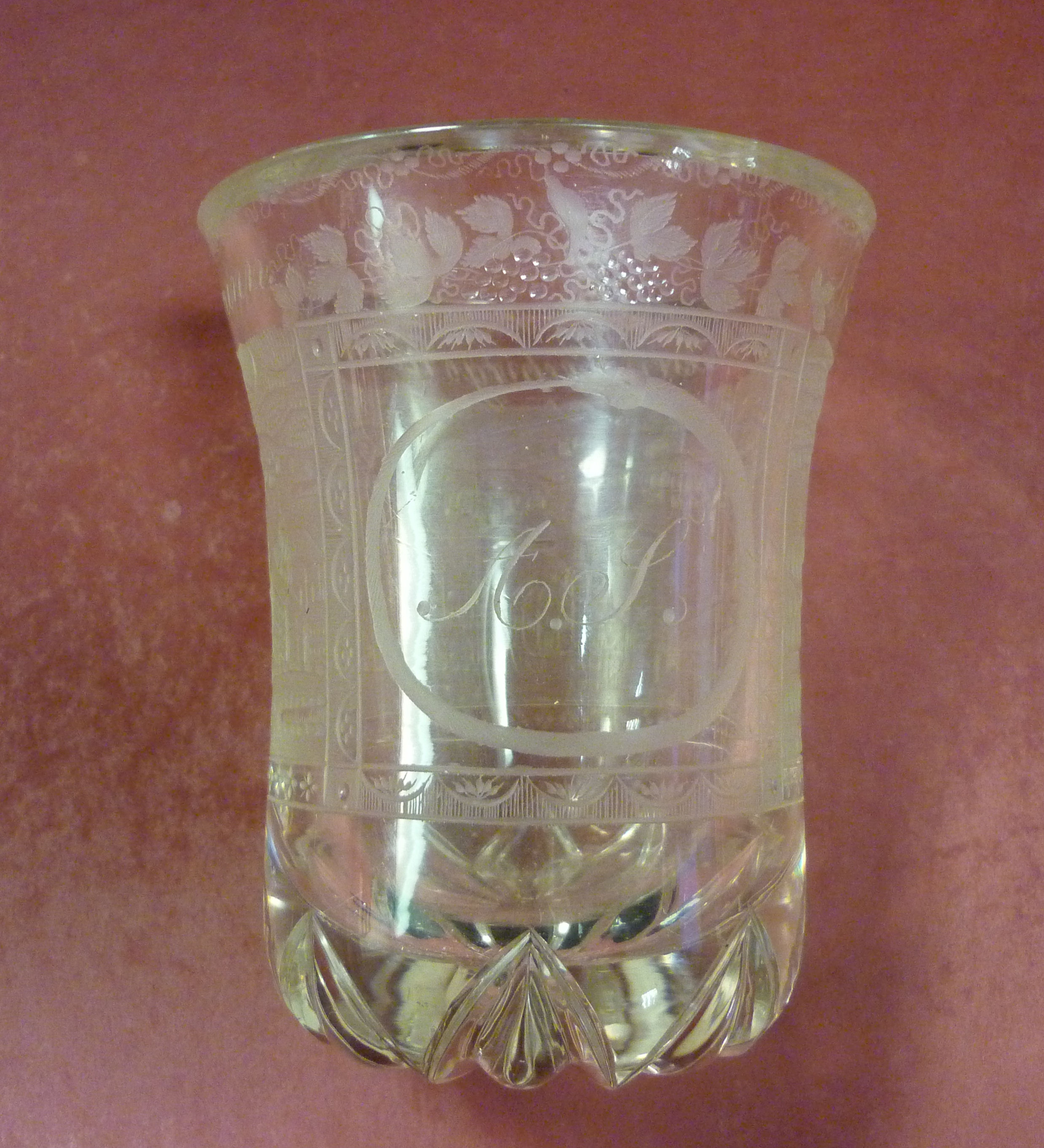 A late 19thC Bavarian glass beaker vase, having a flared rim and a lobed base, engraved and acid