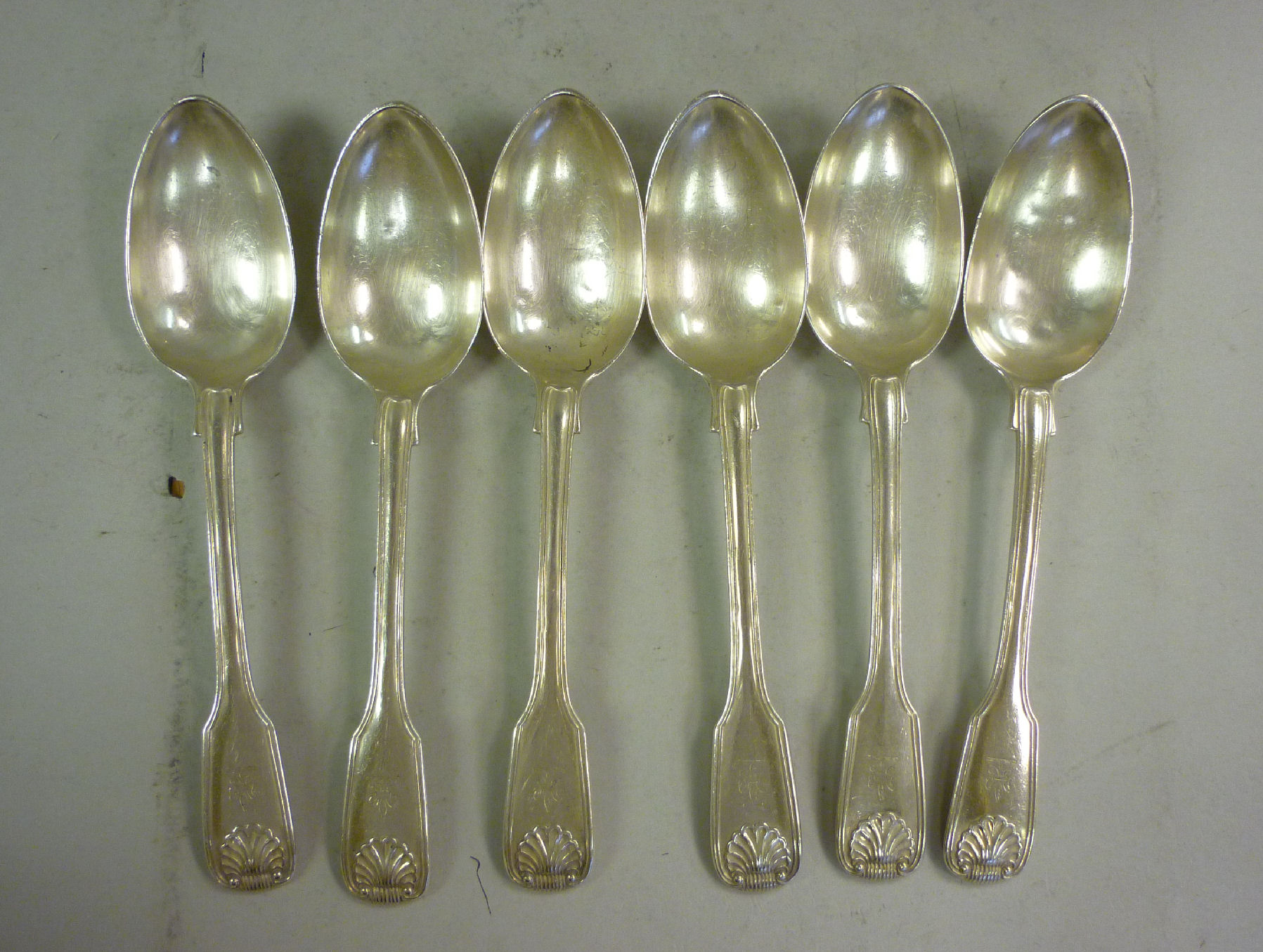 A set of six early Victorian silver fiddle, thread and shell pattern dessert spoons Robert,