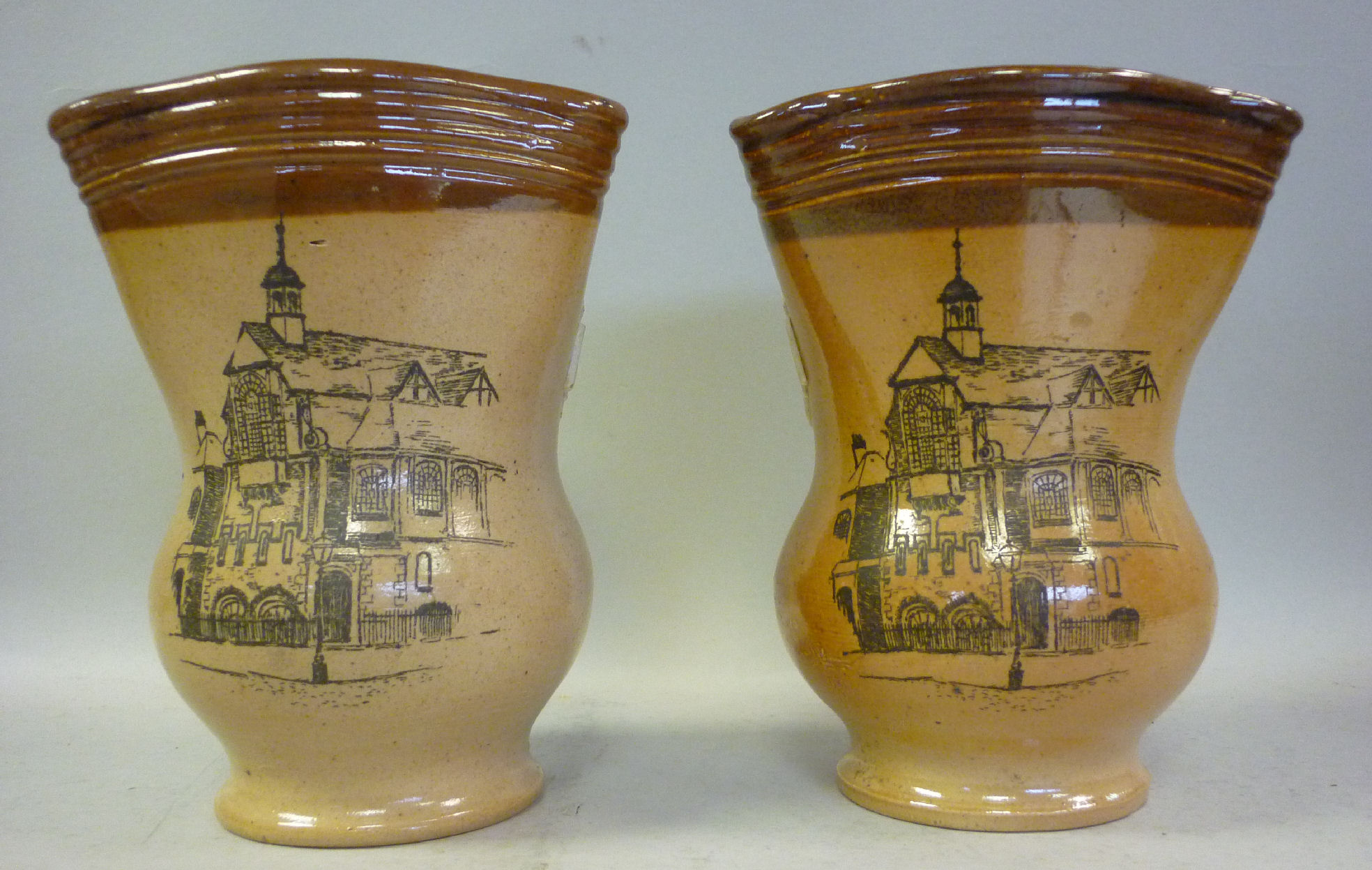 A matching pair of late 19thC Doulton Lambeth two tone brown glazed stoneware vases of bulbous