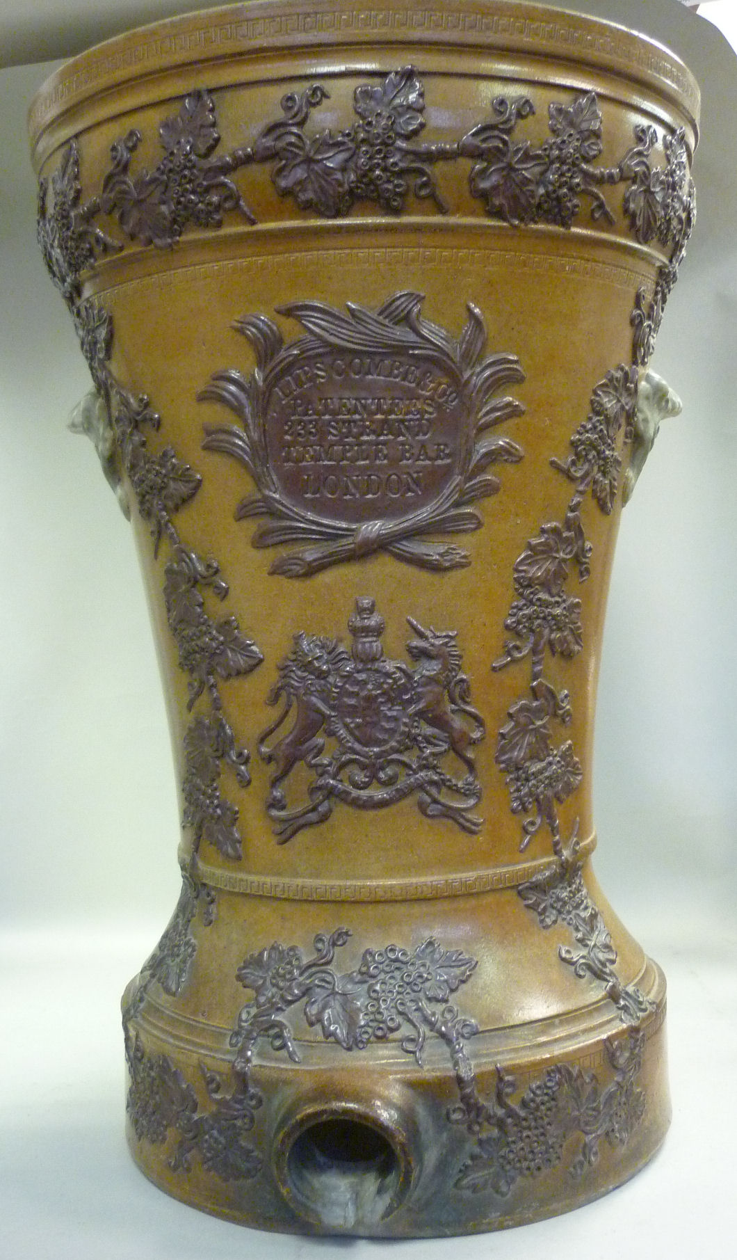 A late 19thC brown salt glazed stoneware water filter reservoir of waisted form, decorated in