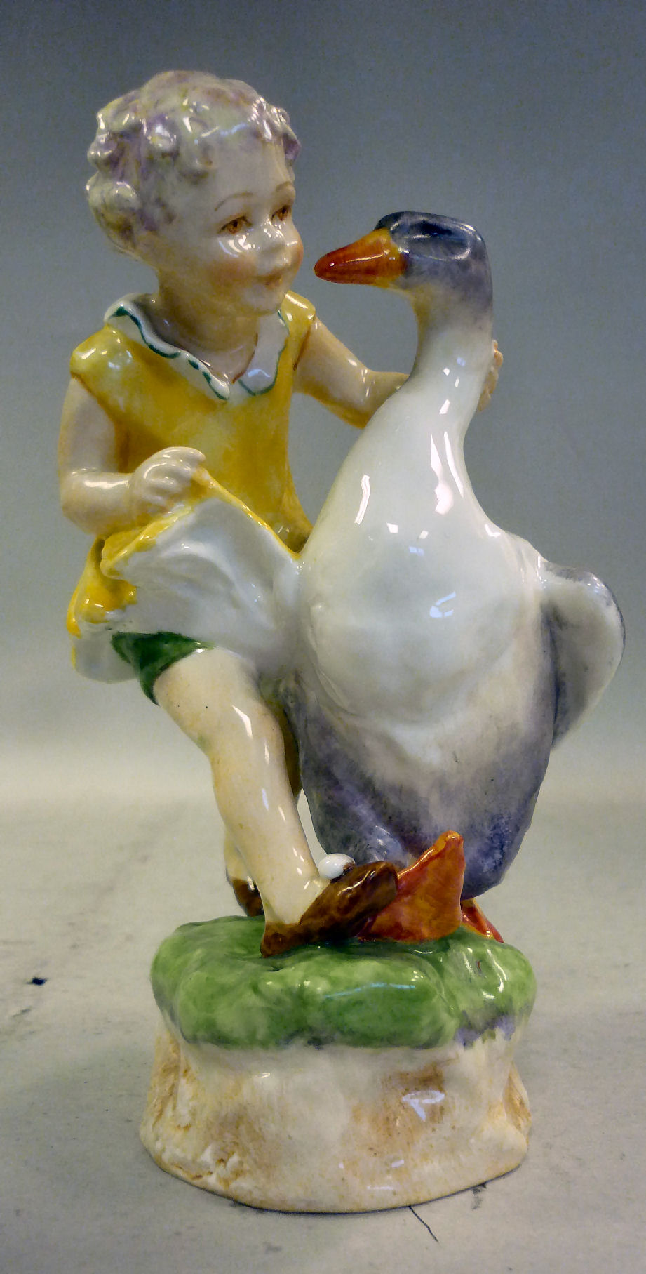 A Royal Worcester china figure `Goosie Goosie Gander` No.3304 bears a date cypher for 1937 6``h