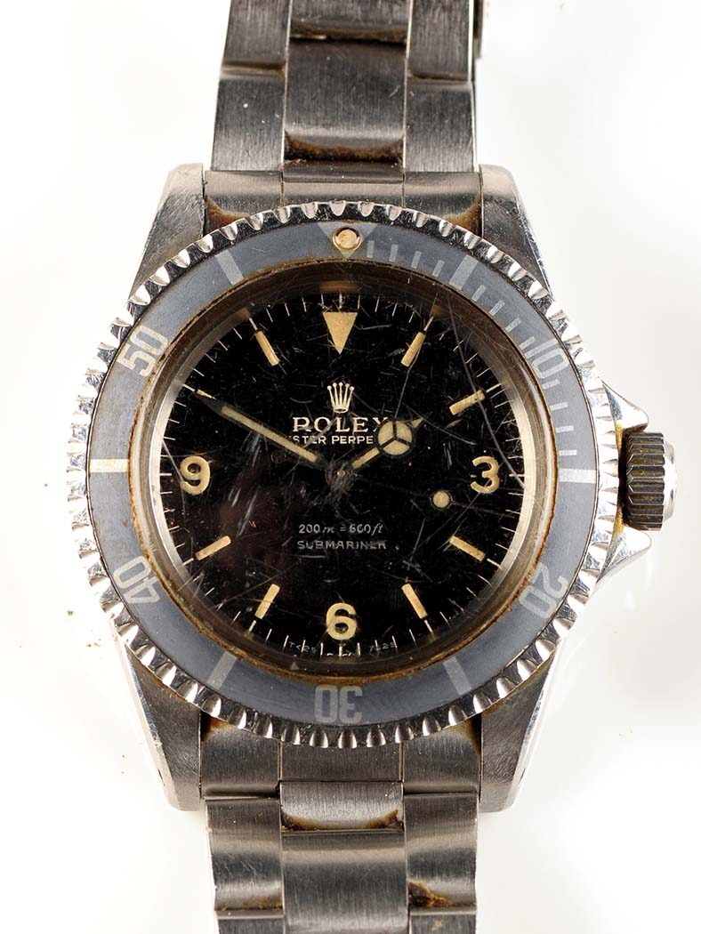 A steel cased Rolex Oyster Perpetual Submariner, the black face with arabic and baton dial, fixed