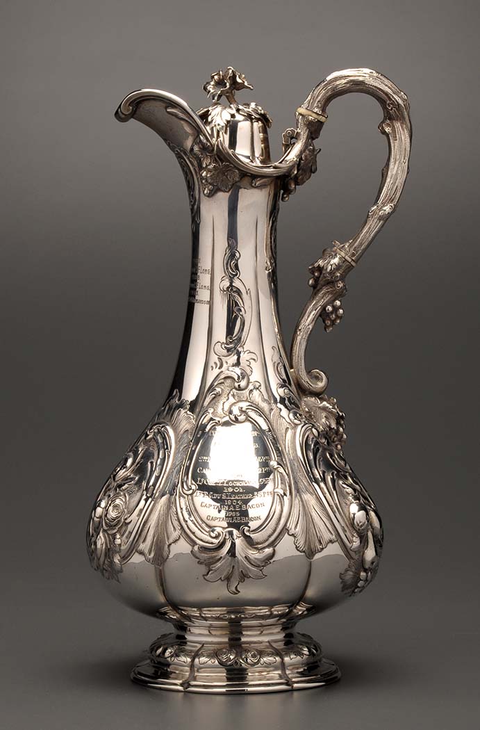 A Victorian claret jug, by Edward & John Barnard, London 1856, of fluted baluster form, the domed