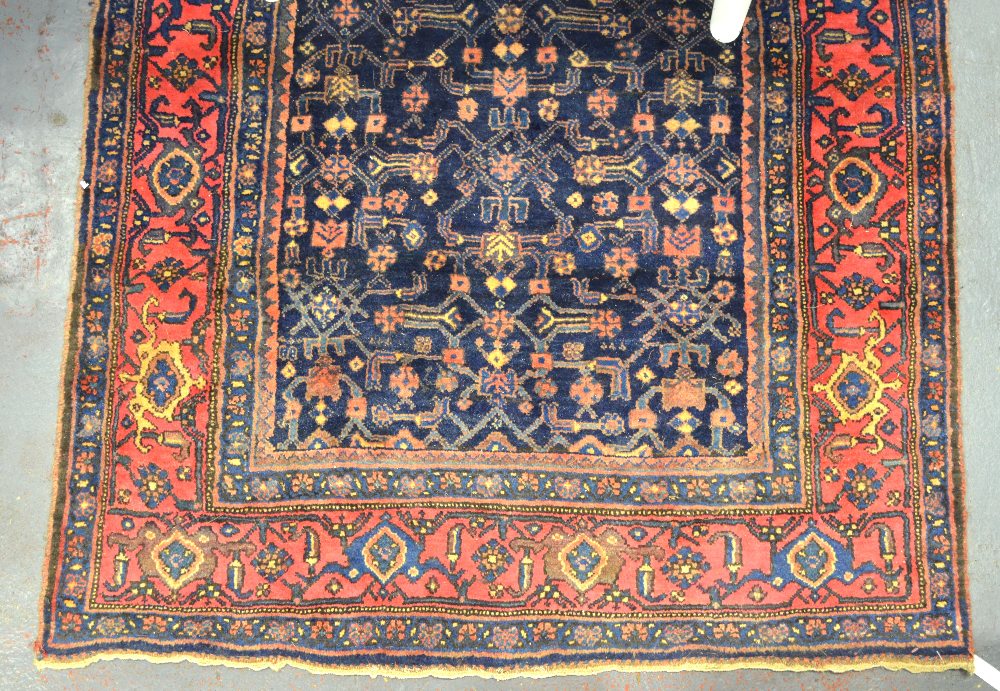 Persian Senneh wide runner, all-over design on blue field within multi-border, 315 x 143 cm