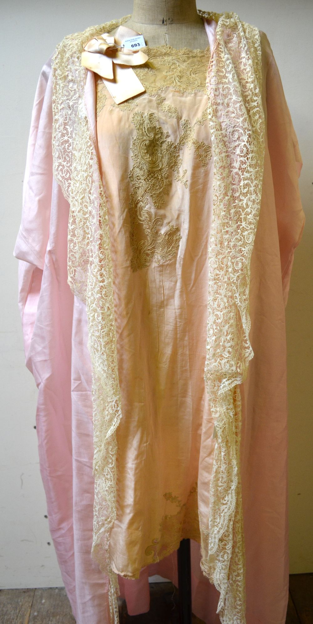 Peach silk nightdress inset with mocha lace and bow to one side, a shell pink negligee coat with