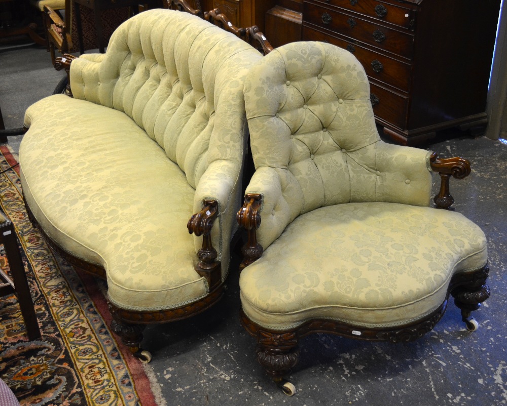 Victorian carved walnut framed serpentine form splay end conversation sofa with button upholstery,