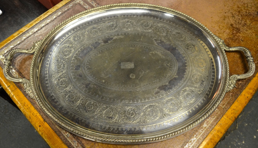 A Victorian ep large oval tray with twin cast handles and rope-twist rim, engraved decoration, 70 cm