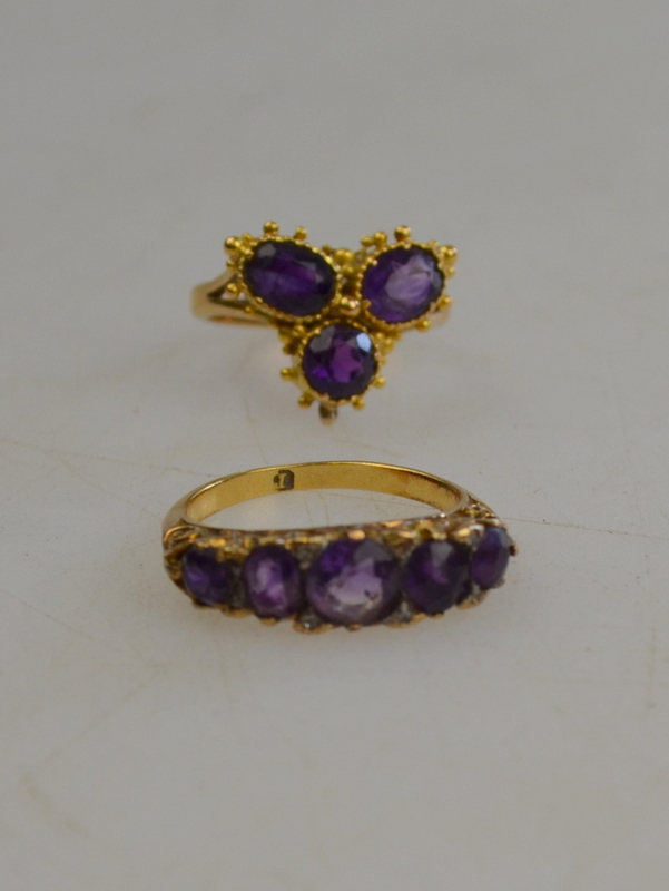 Five-stone amethyst ring with rose points between to/w amethyst trefoil ring both yellow gold,
