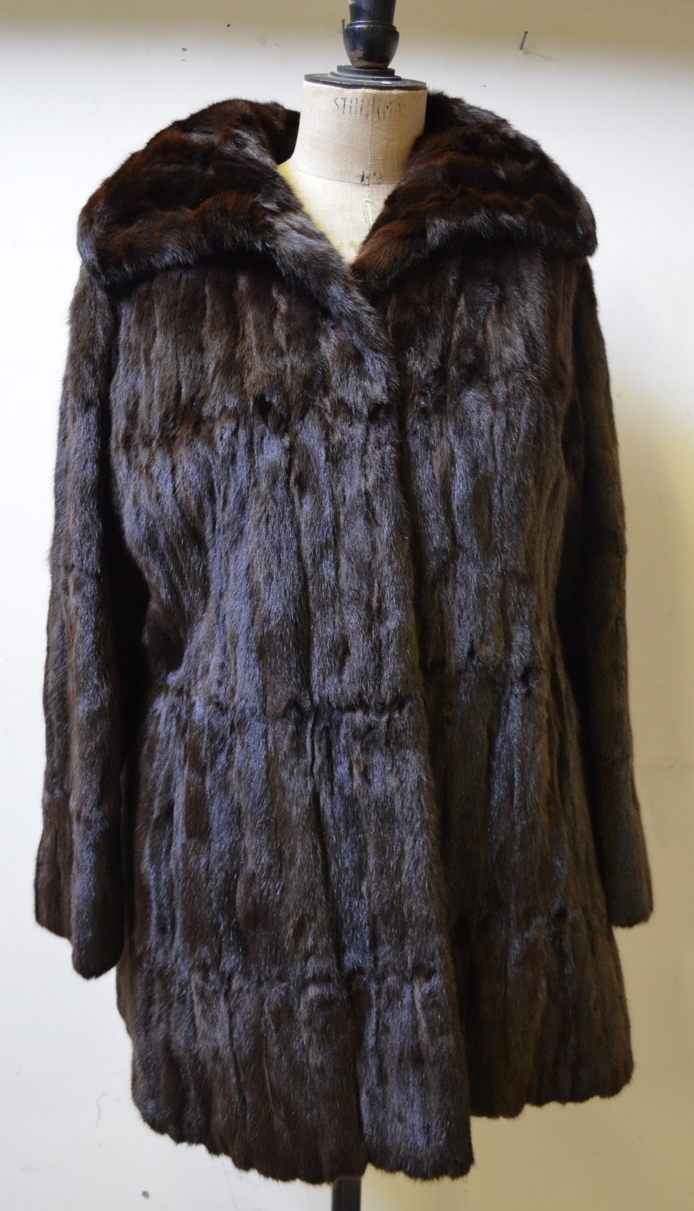 Dark brown three-quarter length squirrel fur coat with brown satin lining, 50 cm across chest