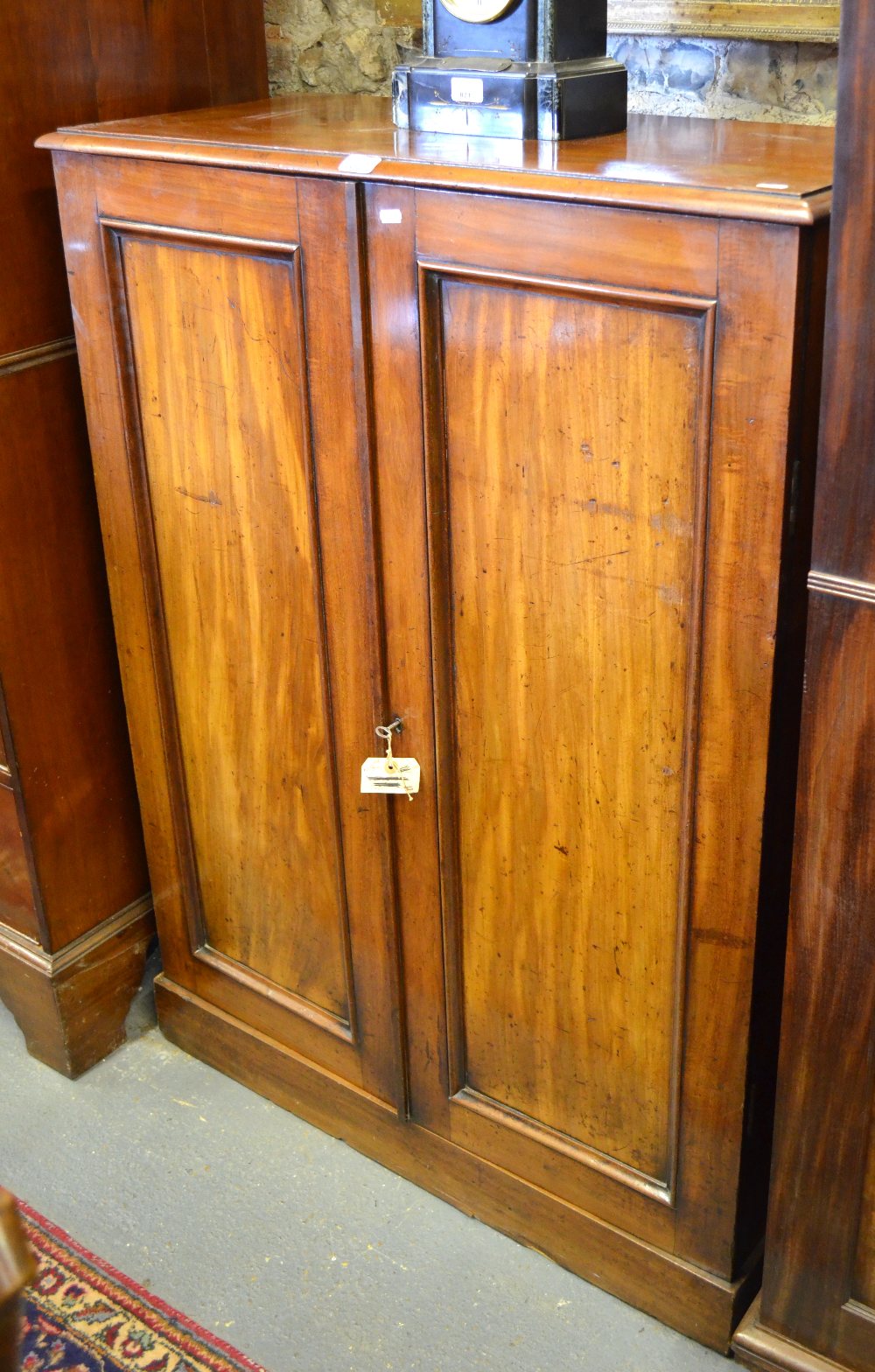 Victorian mahogany campaign cabinet, the hinged top enclosing a deep storage well over three drawers