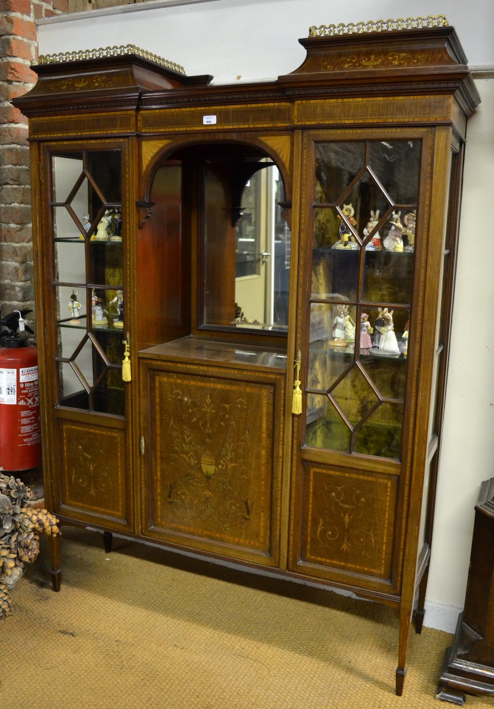 A 19th century satinwood crossbanded and inlaid walnut display cabinet in the Edwards & Roberts