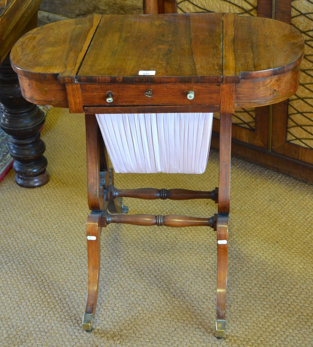 Victorian rosewood work table the top with hinged centre section enclosing an arrangements of