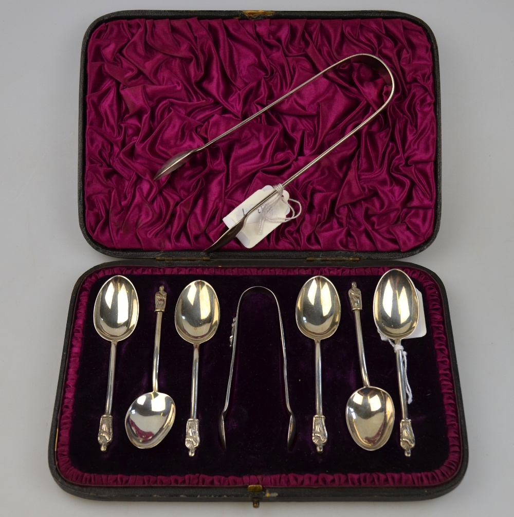 A Victorian cased set of six coffee spoons and tongs with apostle finials, William Hutton & Sons,