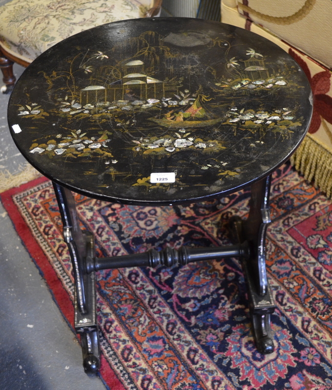 A Victorian black lacquered papier mache table, the Chinoiserie top decorated in gilt and mother-