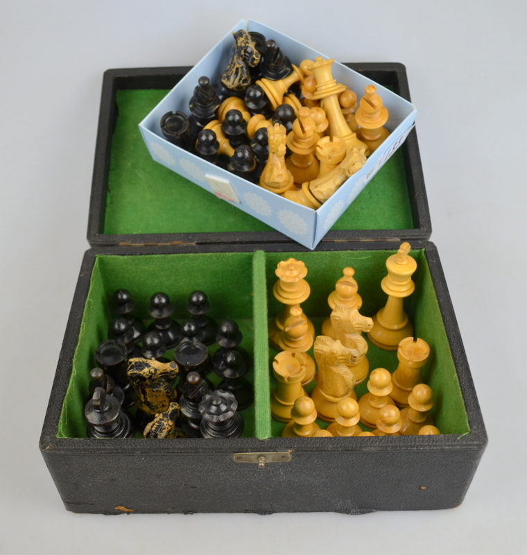 A turned wood chess set, the box inscribed 'R.M.L. Ltd.', to/w a similar incomplete set Condition