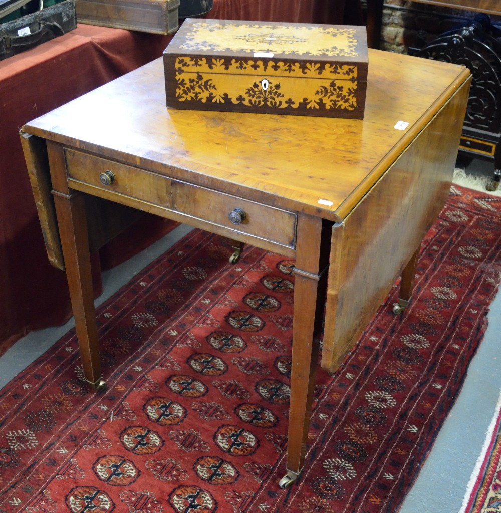 An Edwardian cross-banded Yew wood table, the rectangular top with rounded corner drop leaves over a