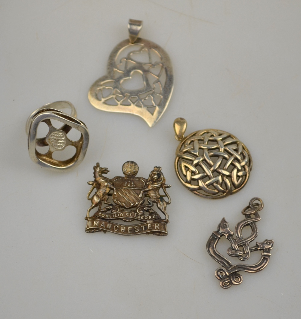 Collection of four silver items including ring, pierced heart pendant, Celtic pendant, City of