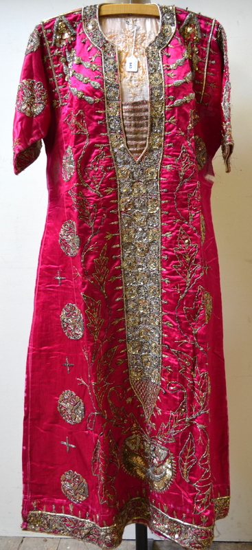 Indian cerise silk robe with embellished front panel and roundels worked in metalised thread and