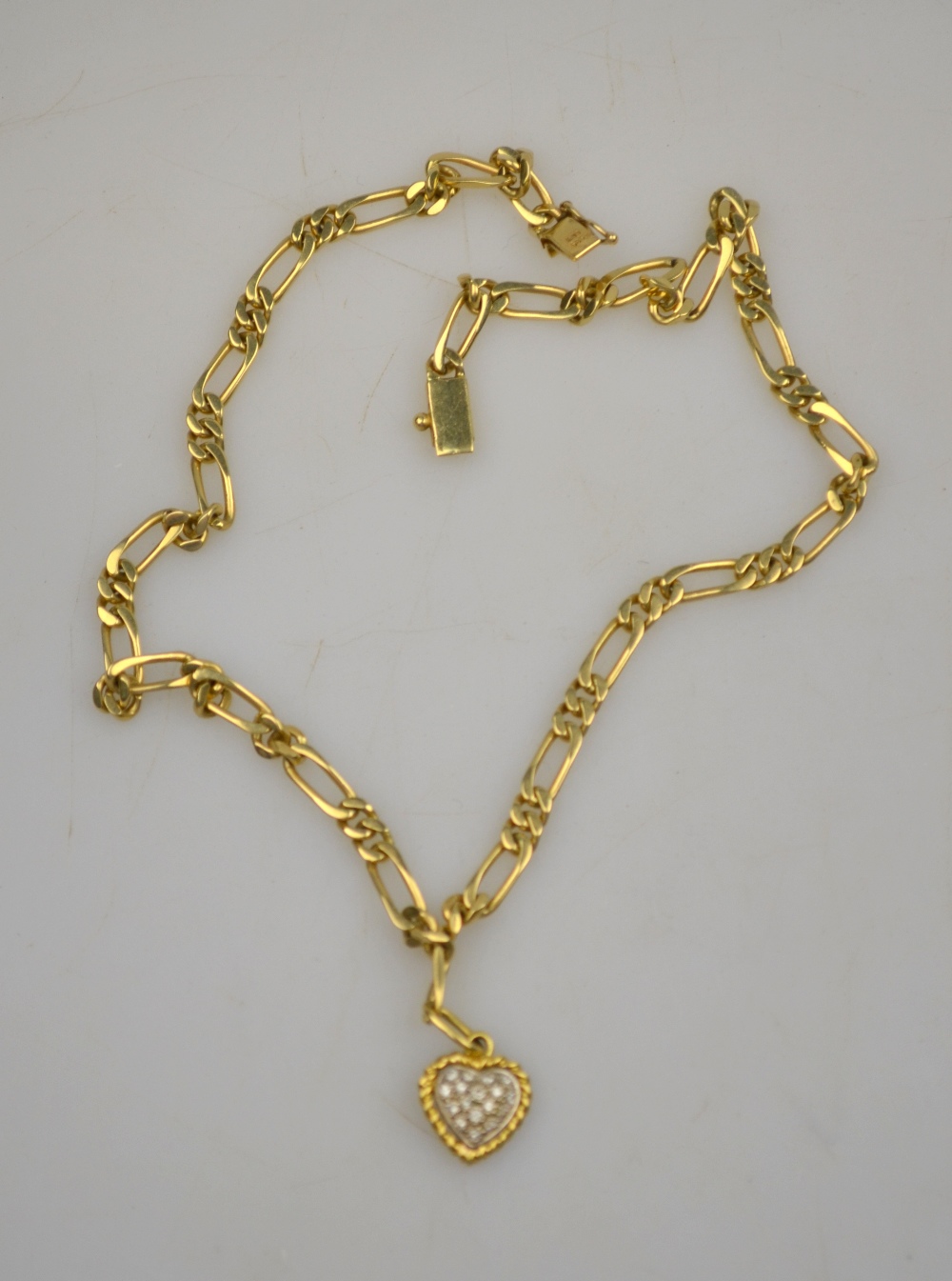 14ct yellow gold fetter and three necklace chain having yellow and white metal diamond set heart