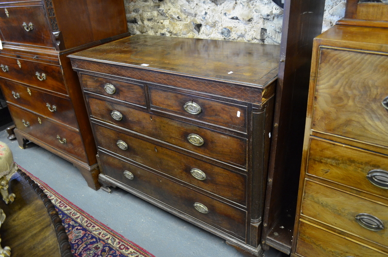 An 18th century crossbanded mahogany chest of 2 short over 3 long graduated drawers flanked by
