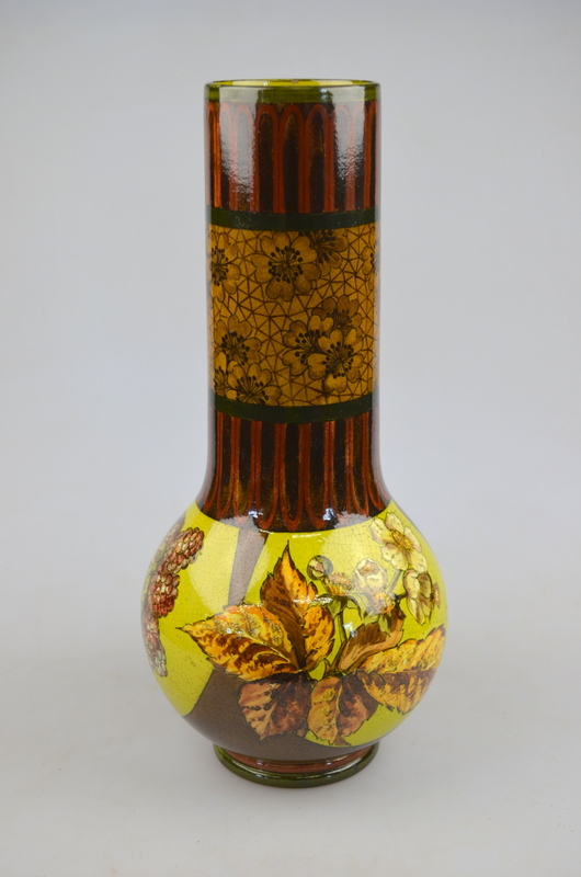 Doulton Lambeth faience vase painted with blackberries, flowers and foliage on a lime green