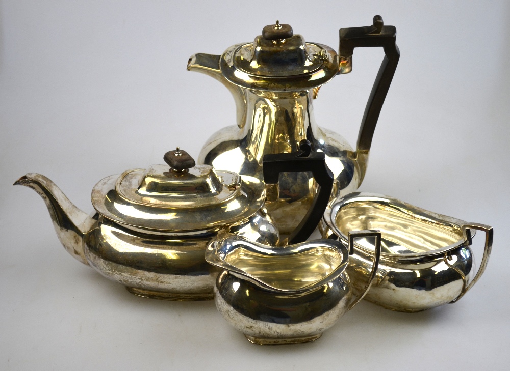 A silver four-piece tea service of oval bulbous form with composite mounts John Round & Sons Ltd.,