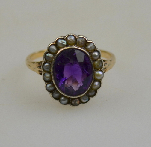 Oval amethyst and half pearl cluster ring in millgrain setting, yellow metal set, size L 1/2