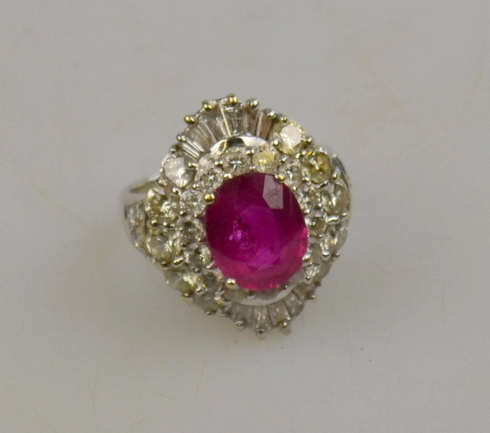 Oval ruby and diamond cluster ring central oval ruby with brilliant cut and tapering baguette