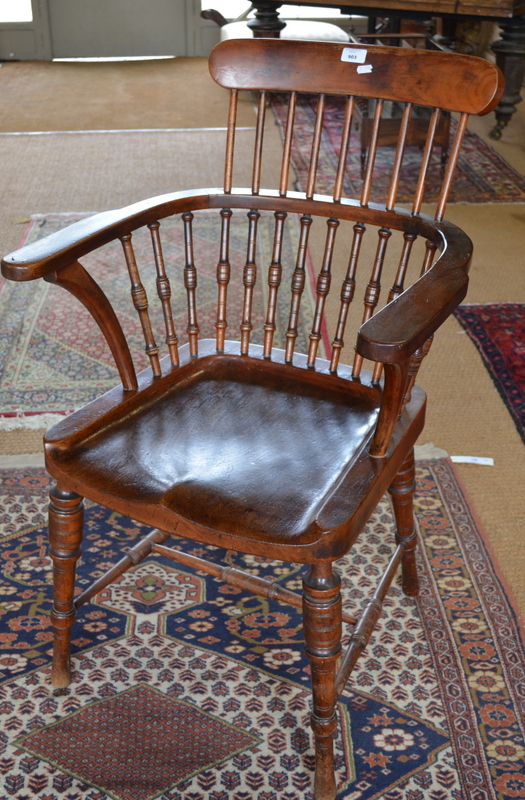 A late 19th century spindle back fruitwood elbow chair