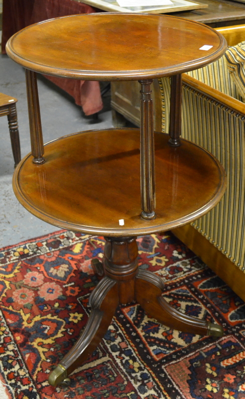 A Regency mahogany two-tier circular dumb waiter, the revolving graduated tiers united by