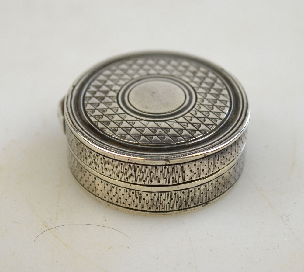A George III silver circular vinaigrette with gilt interior and engraved decoration, maker's mark