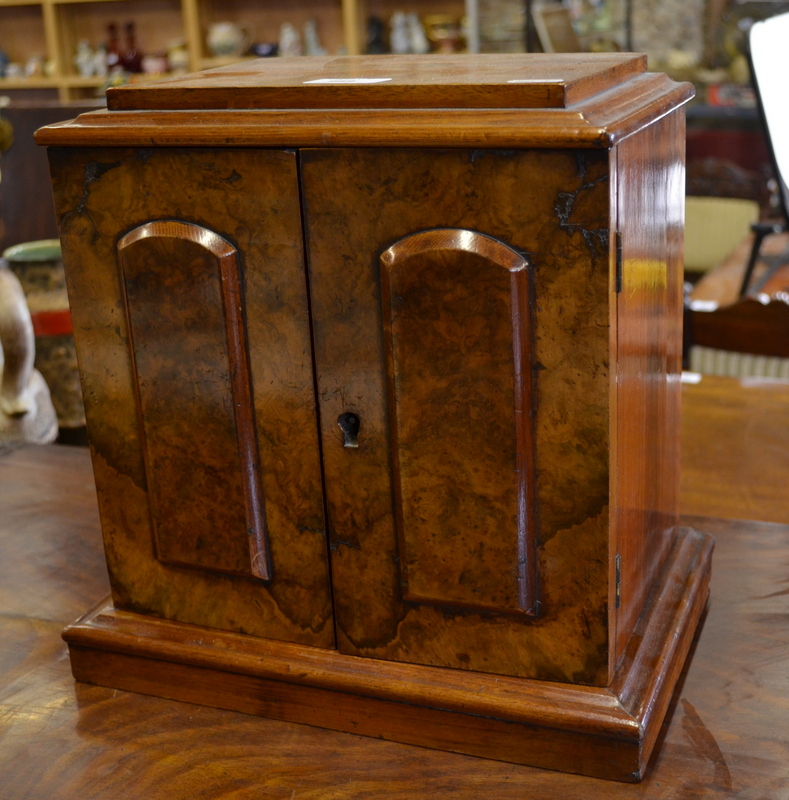 Victorian walnut cigar table-top humidor, the pair of panelled doors enclosing three drawers, raised