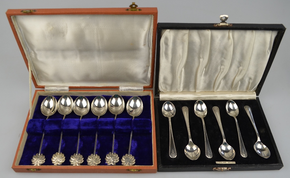 A cased set of six coffee spoons marked 'Sterling', 2.4 oz, to/w an Indian unmarked set of six