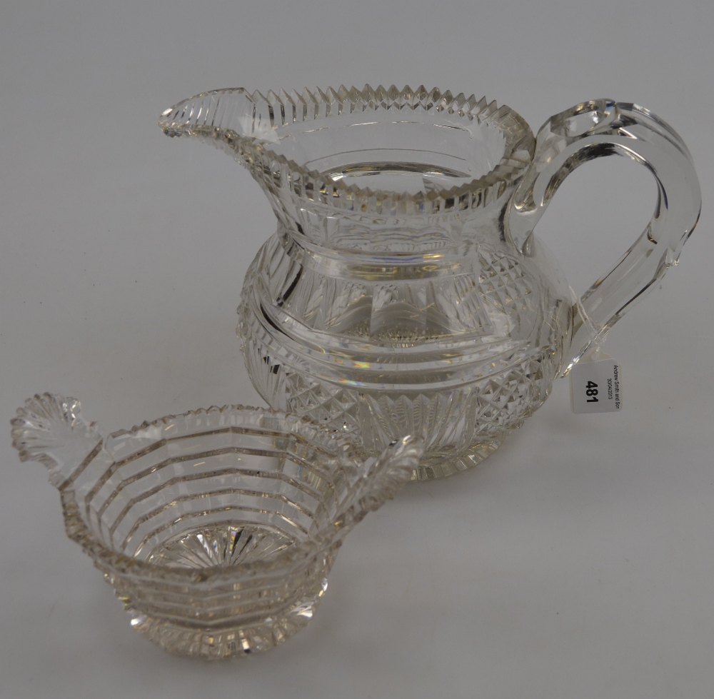 An early 19th century heavy lead crystal water jug with serrated cut rim, probably Irish, 16.6 cm h.