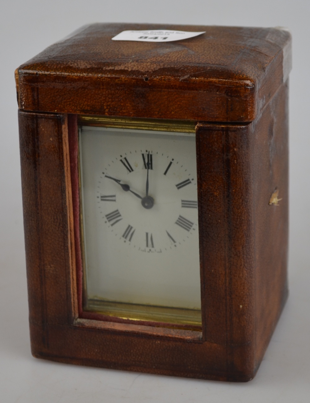 A French brass carriage clock with enamel dial in leather outer case Condition Report Case for
