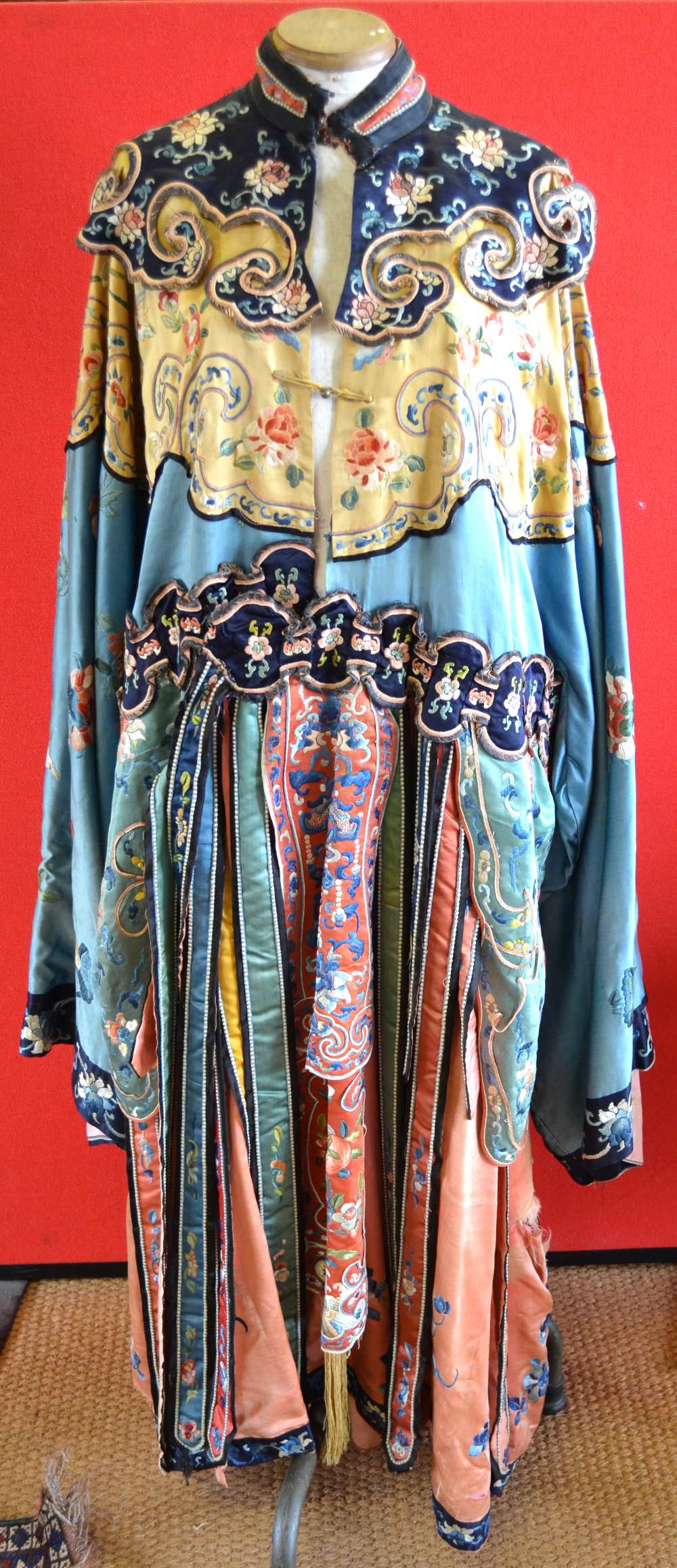 Chinese silk ceremonial robe profusely worked with floral sprays and embellished with panels hanging