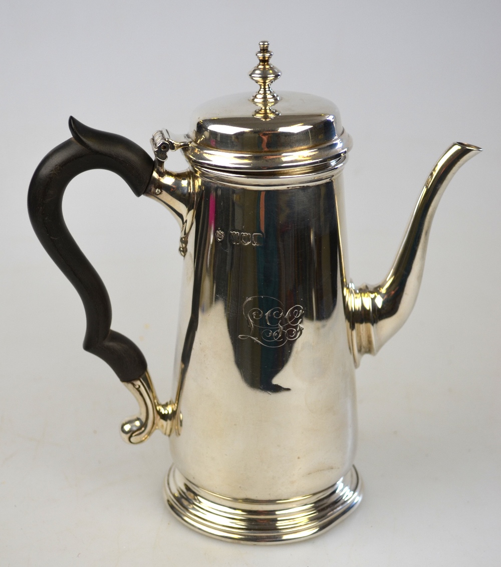 An Edwardian silver small coffee pot in the early Georgian taste, of plain tapering form, Edward