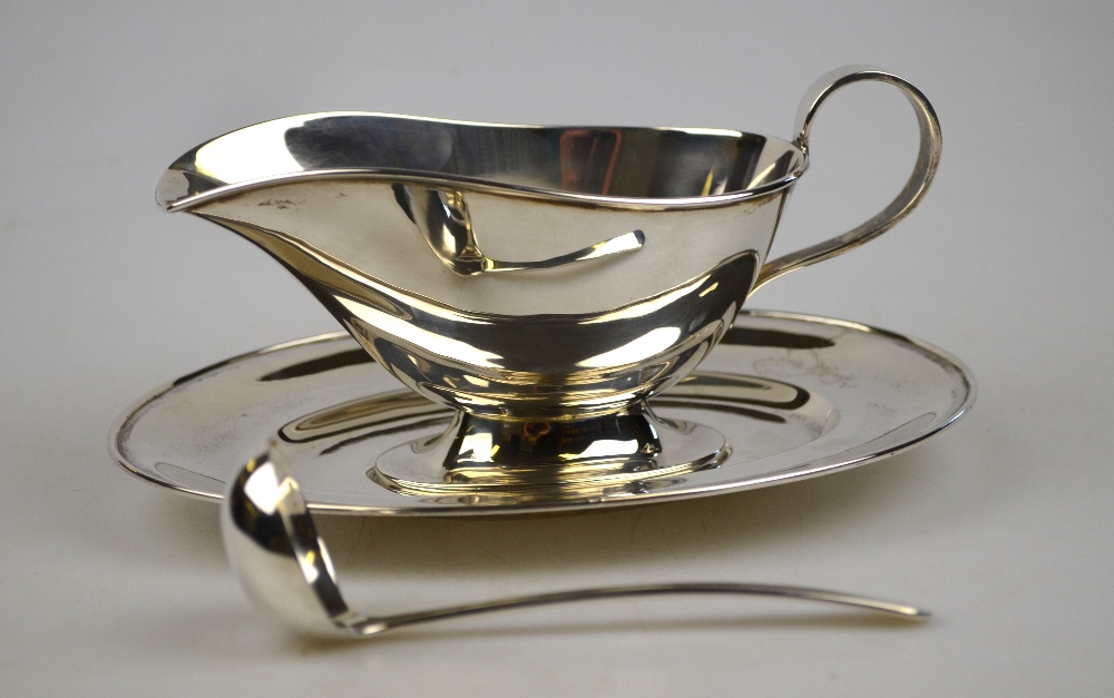 An Indian white metal gravy boat on stand with ladle, stamped 'Orr, silver', 11.5 oz (Peter Orr of