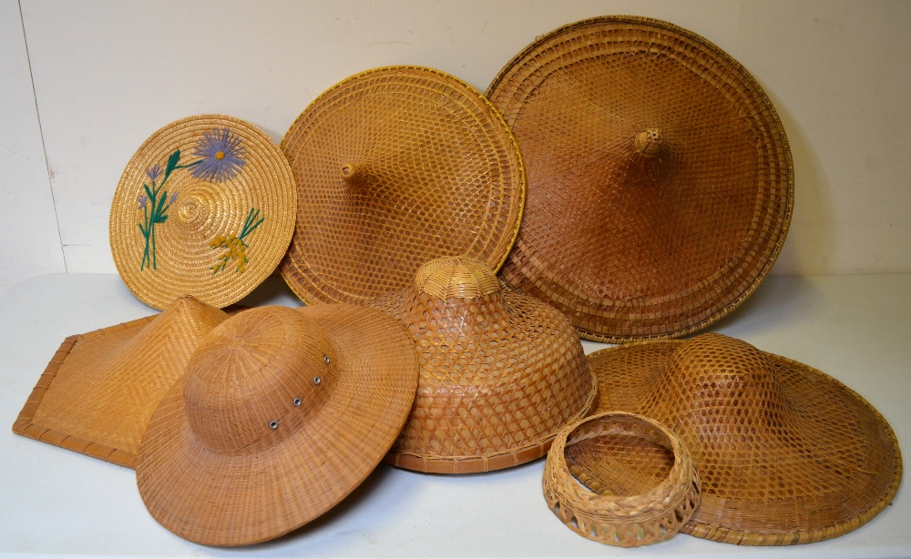 Five Chinese traditional woven rattan hats, a finely woven rattan hat and a woven straw hat