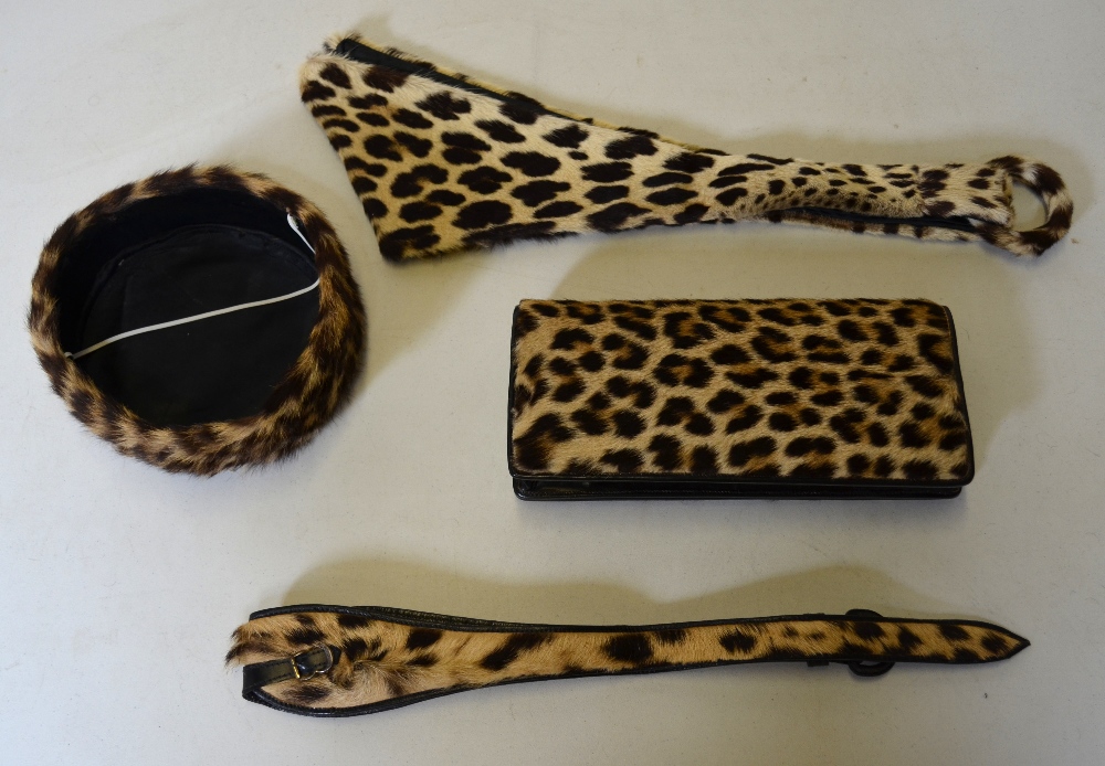 WITHDRAWN 1950's leopard fur and black leather clutch bag, leopard fur pill box hat, leopard fur