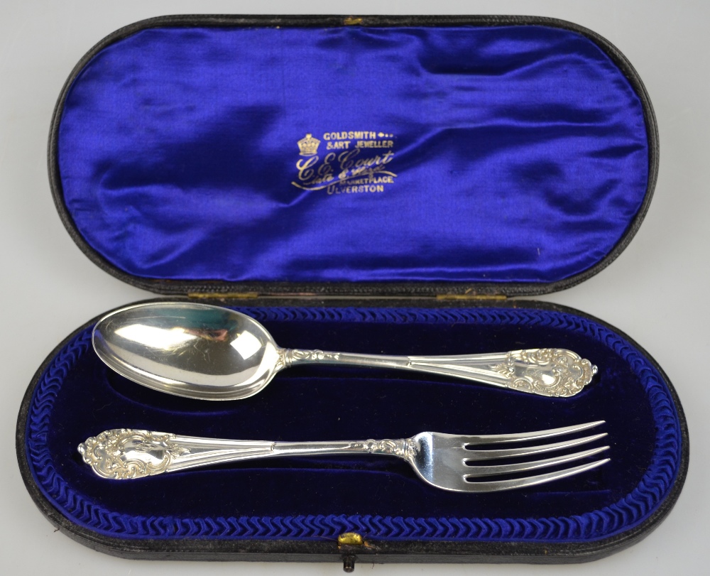 A cased silver Christening spoon and fork with rococo scroll finials, Josiah Williams & Co.,