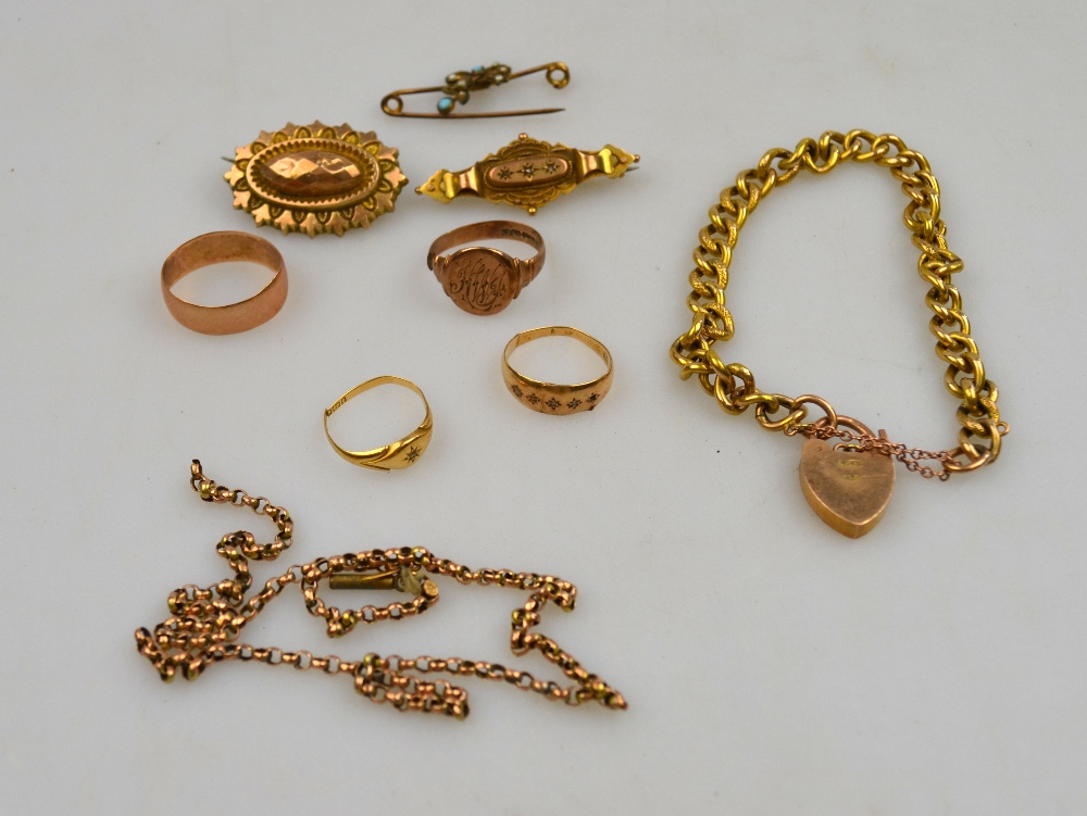 A small quantity of gold items including 9ct curb style bracelet, four 9ct rings, three brooches,