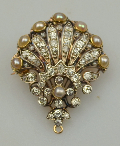 An Edwardian diamond and pearl set fan-shaped pendant brooch, gold and silver set, removable