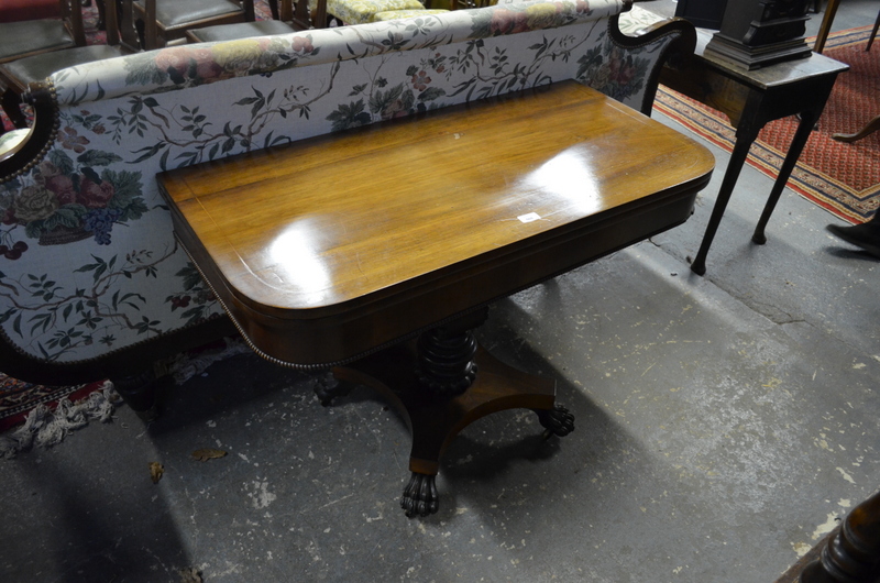 Regency rosewood tea table, the fold over top raised on a combination turned and square section